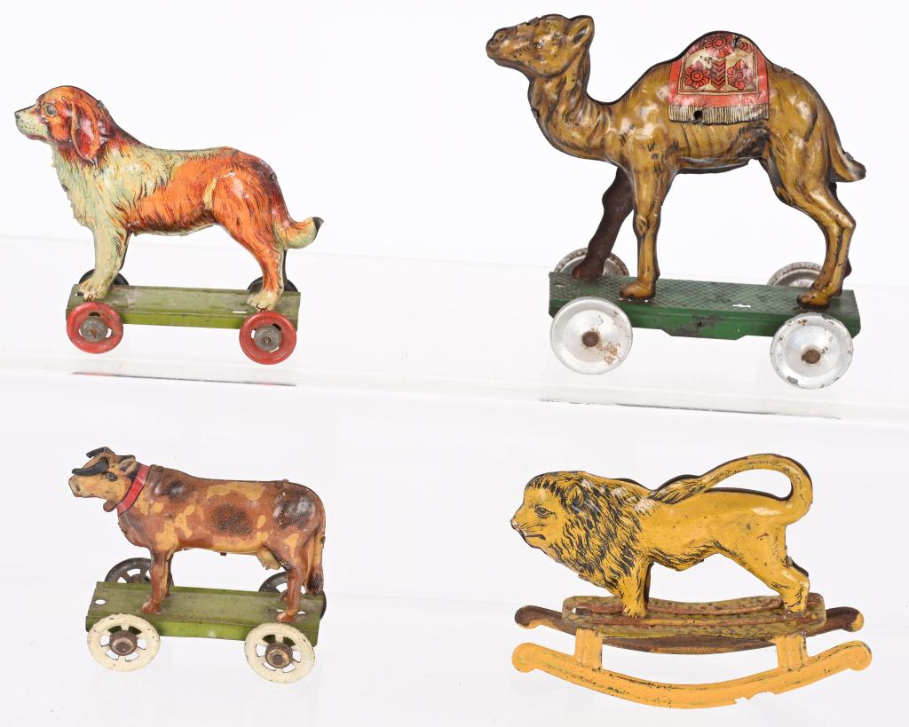 4- GERMAN PENNY TOY ANIMALS: Lot of 4 German Penny Toy Animals. Includes Lion, Camel, Cow, and Dog. All with nice details. Largest 4" Excellent