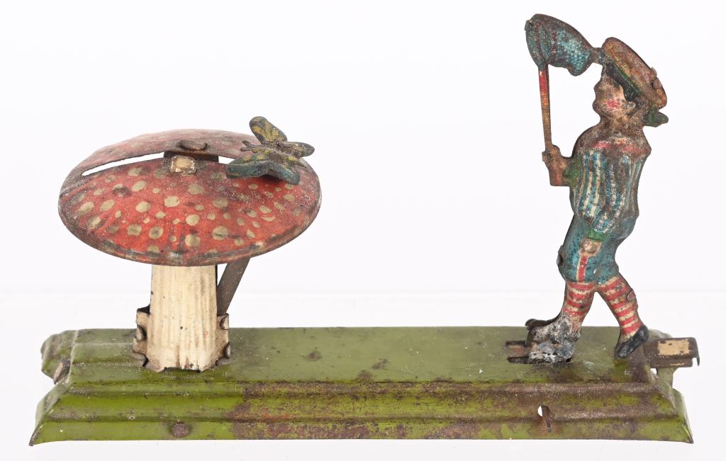 GERMAN PENNY TOY BOY WITH BUTTERFLY: German Penny Toy Boy with Butterfly, Very nice details. 4" Very Good -Provenance Max Berry Collection