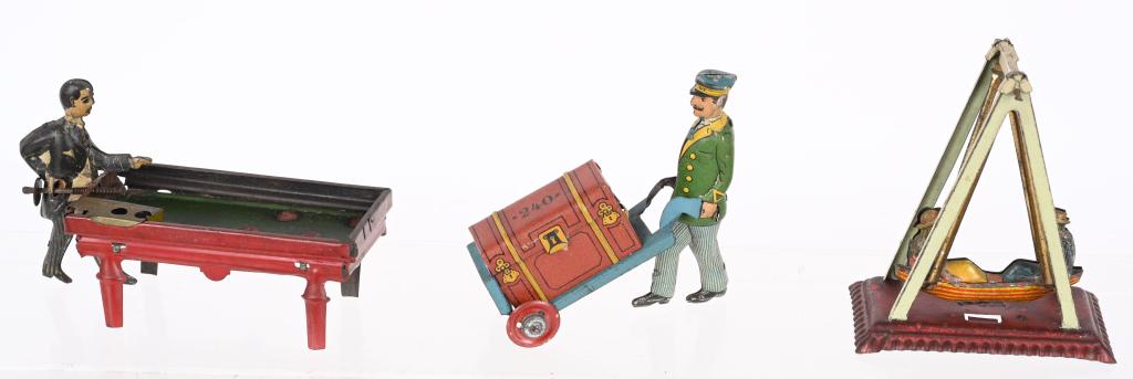 3- GERMAN PENNY TOYS: Lot of 3 German Penny Toys includes Porter with Luggage, Billiards Player, and Couple on Swing. All with nice details. Largest 4" Very Good-Excellent