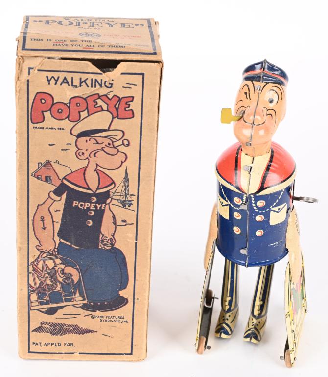 MARX TIN WINDUP POPEYE WITH PARROT CAGES w/ BOX: Marx tin windup Popeye with Parrot Cages. All original and complete. Toy has nice colors. Windup works. Includes graphic original box. A very nice example of this toy. 8 1/2" Excellent