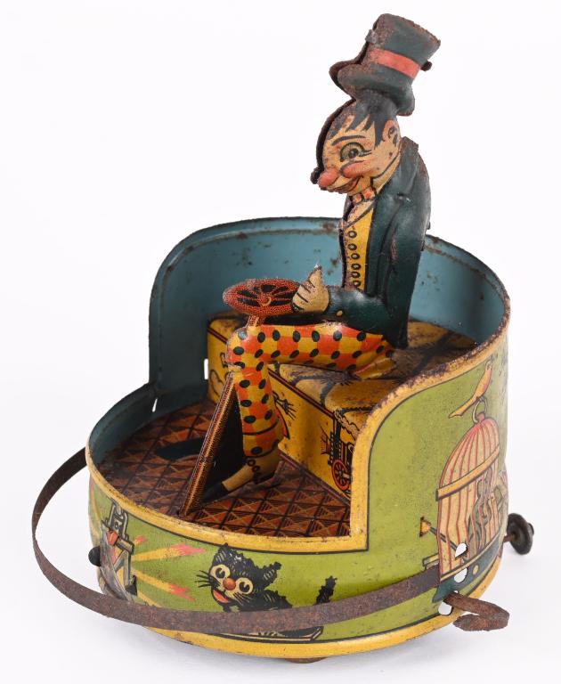 GUNTHERMANN TIN WINDUP JIGGS BUMPER CAR: Scarce Guntmermann tin windup Jiggs Bumper Car. Very unusual version with green Bumper Car with Cat, Dogs, and Bird graphics. Only version like this we have seen. All original and windup works. Has so