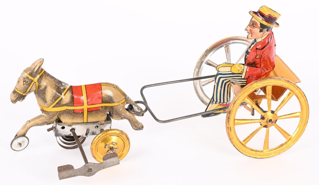 SPANISH TIN WINDUP HAROLD LLOYD DONKEY CART: RARE Spanish tin windup Harold Lloyd Donkey cart. All original an din an amazing condition. Very bright colors. Windup works. A very scarce toy! 9 1/2" Excellent