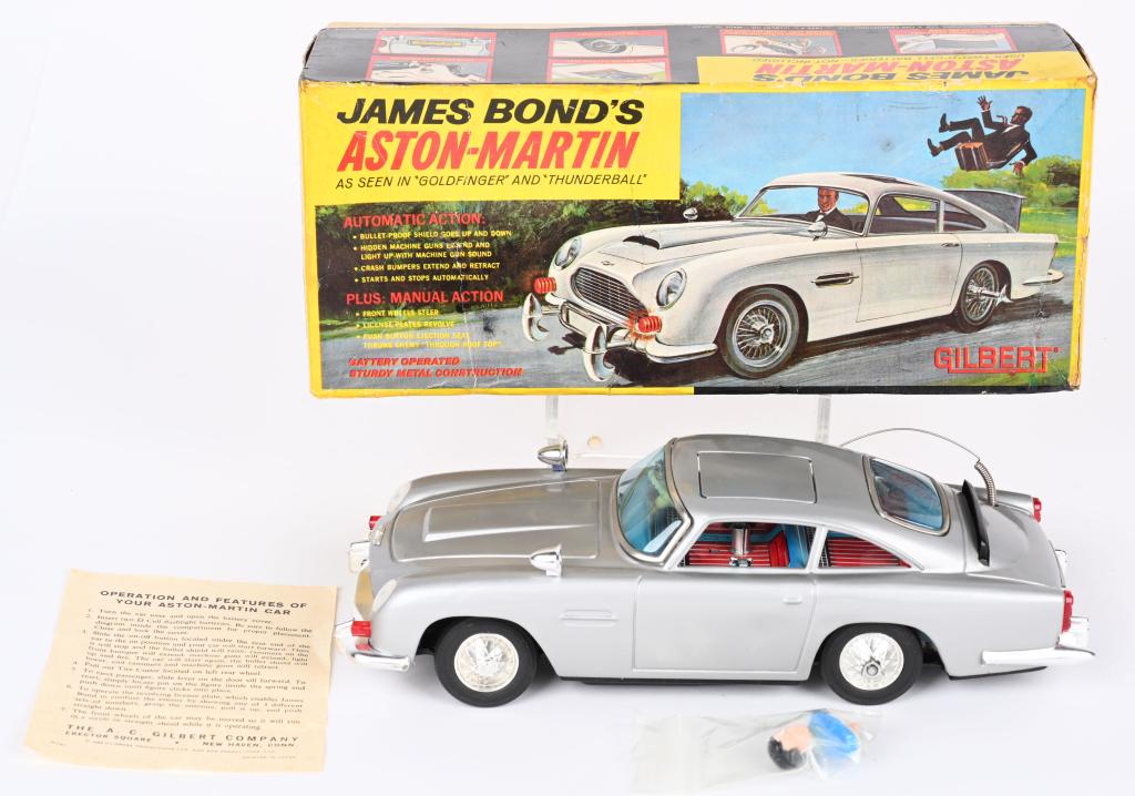 GILBERT BATTERY OP JAMES BOND'S ASTON MARTIN wBOX: AC Gilbert battery operated James Bond 007 Aston Martin. All original and looks basically never played with condition. Still has James Bond figure. Clean battery box. Worked when tested. With Box and 