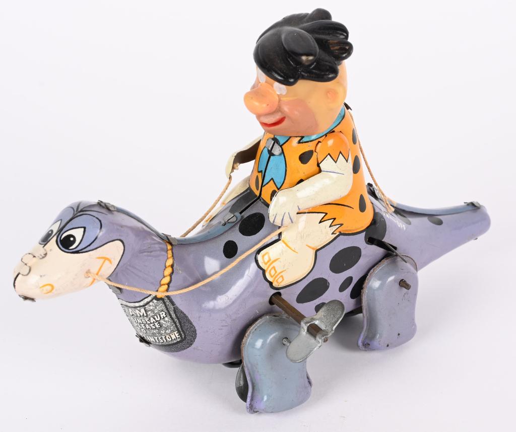 MARX TIN WINDUP FRED ON DINO: Marx tin windup Fred on Dino. All original with nice colors. Windup works. 8" Excellent