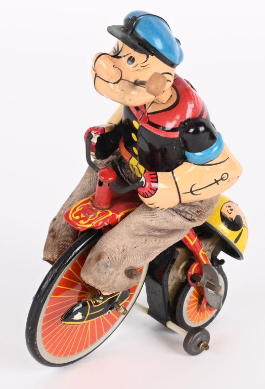 LINEMAR TIN WINDUP POPEYE ON HIGH WHEEL BIKE: Linemar tin windup Popeye on High Wheel Bike. All original and complete. Still has original bell. Windup works. 7" Very Good-Excellent