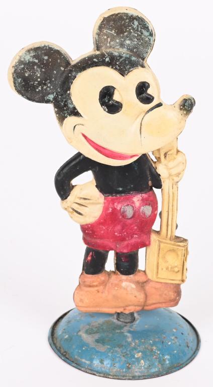 JAPAN CELLULOID MICKEY MOUSE w/ GUITAR: Japan celluloid Mickey Mouse with Guitar. Toy has some repair and replaced rubber band. Not working properly. Displays well. 6" Very Good