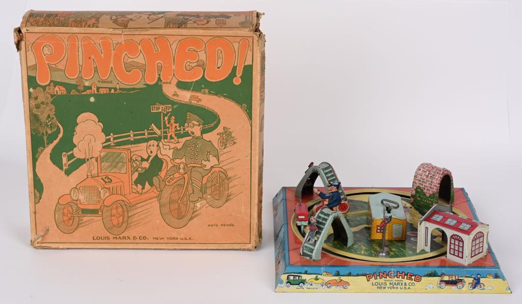 MARX TIN WINDUP PINCHED MOTORCYCLE TOY w/ BOX: Beautiful all original Marx tin windup Pinched with the original box. The toy is in complete working condition with bright colors and gloss. Includes the original graphic box. Measures 9 1/2" by 9 1/2