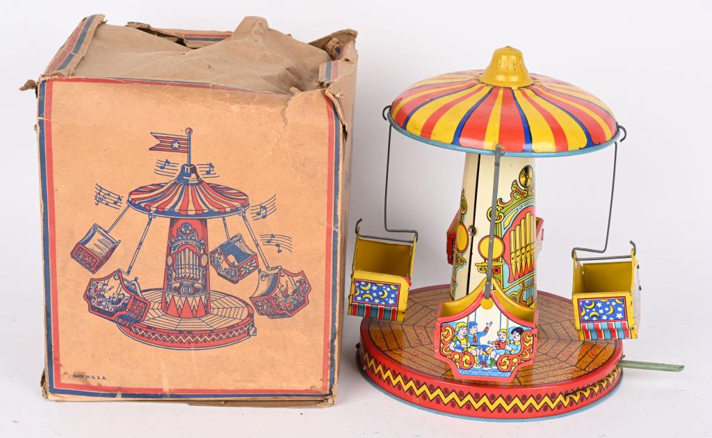 CHEIN TIN WINDUP AERO SWING w/ BOX: Chein tin windup Aero Swing. All original with great colors and graphics. Windup works. Comes with box missing top flaps. 9 1/2" Excellent