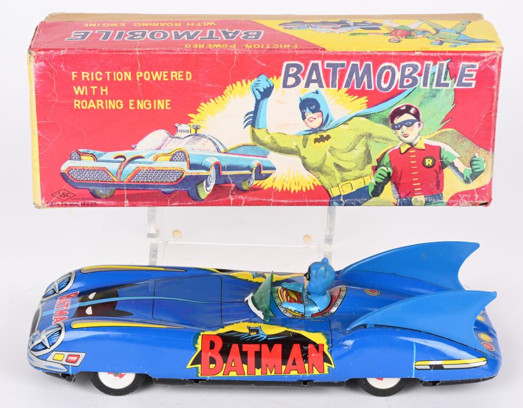 AOSHIN TIN FRICTION BATMOBILE w/ BOX: Scarce Japan tin friction Batmobile. All original with great colors and graphics. Has Batman figure driver. Toy shows only light play wear mostly along bottom. Friction works. Comes in rare Box with g