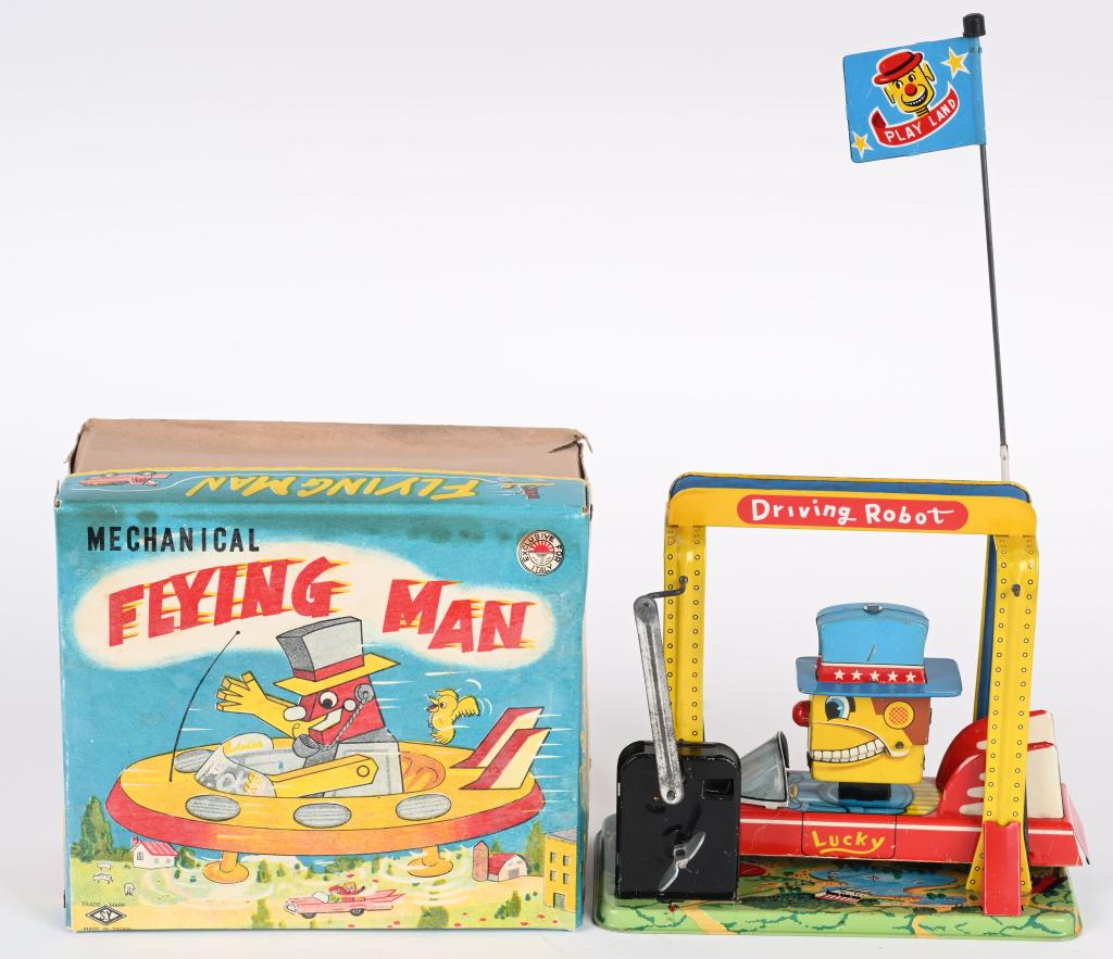 YONEYA TIN WINDUP FLYING MAN w/ BOX: Japan tin windup Flying Man. All original and complete with Flag. Great Robot is Spaceship. Looks basically never played with condition. Boxed 6 1/2" Excellent