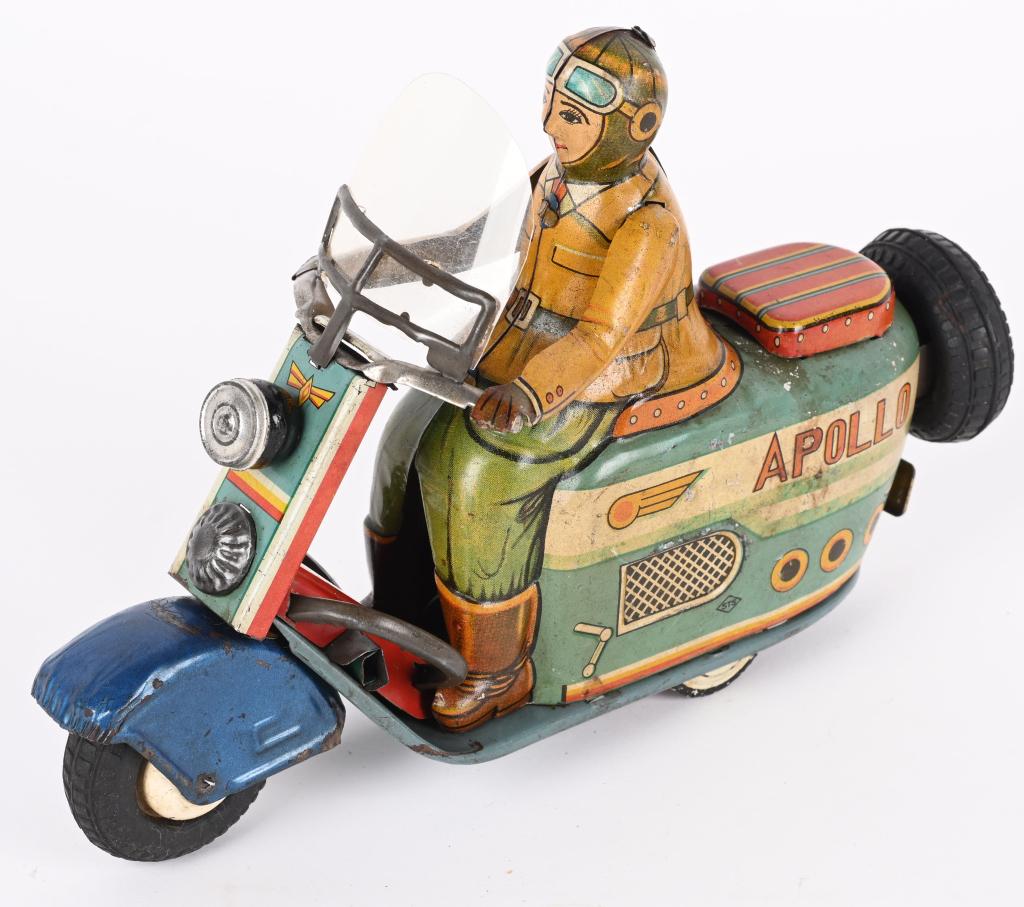 YONEZAWA TIN FRICTION APOLLO SCOOTER: Japan tin friction Apollo Scooter. All original and complete with wind screen and kick stand. Large and impressive toy. Friction works. Has some normal wear. Scarce Scooter toy. 9" Very Good