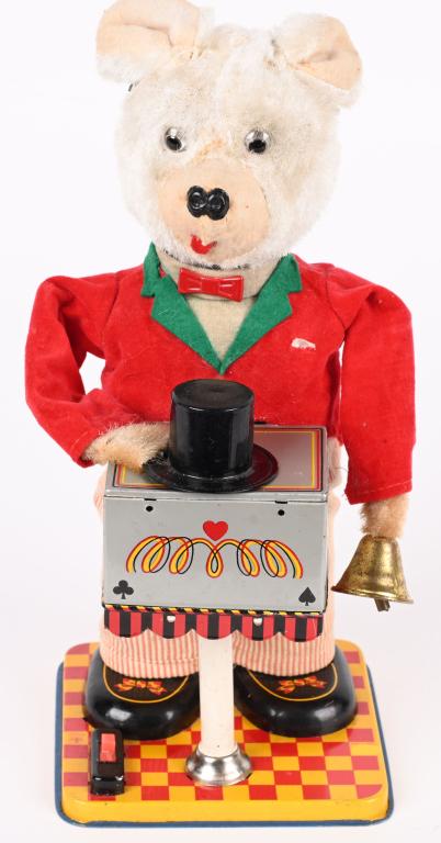 JAPAN BATTERY OP MAGICIAN BEAR: SCARCE Japan battery operated magician Bear. All original and complete. A very clean example. Worked when tested. A very hard toy to find. 11" Excellent