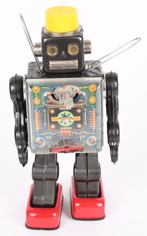 SH BATTERY OP FIGHTING ROBOT: Japan battery operated Fighting Robot. All original and complete. Lights up but does not operate. 11 1/2" Excellent