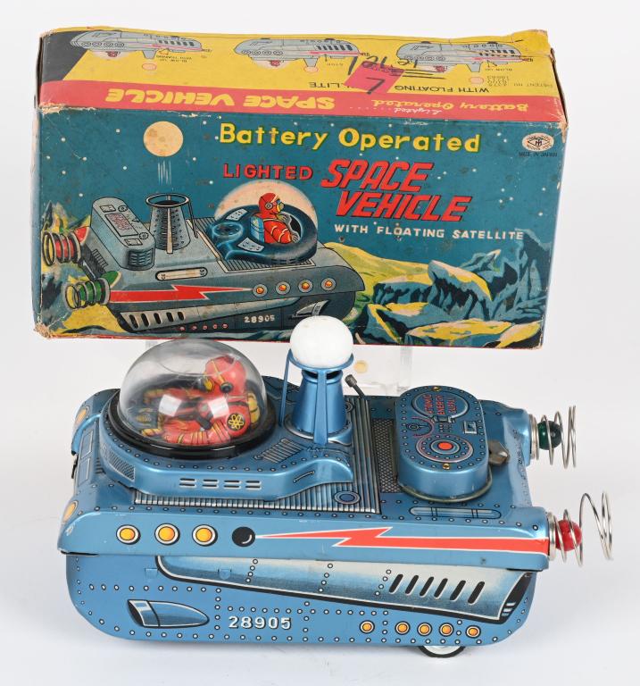 MASUDAYA BATTERY OP SPACE VEHICLE w/ SATELLITE: Japan battery operated Lighted Space Vehicle with Floating Satellite. All original with great design and Spaceman Driver. Still has Satellite Ball. Did not work when tested. Comes with Box Top. 9" Exc