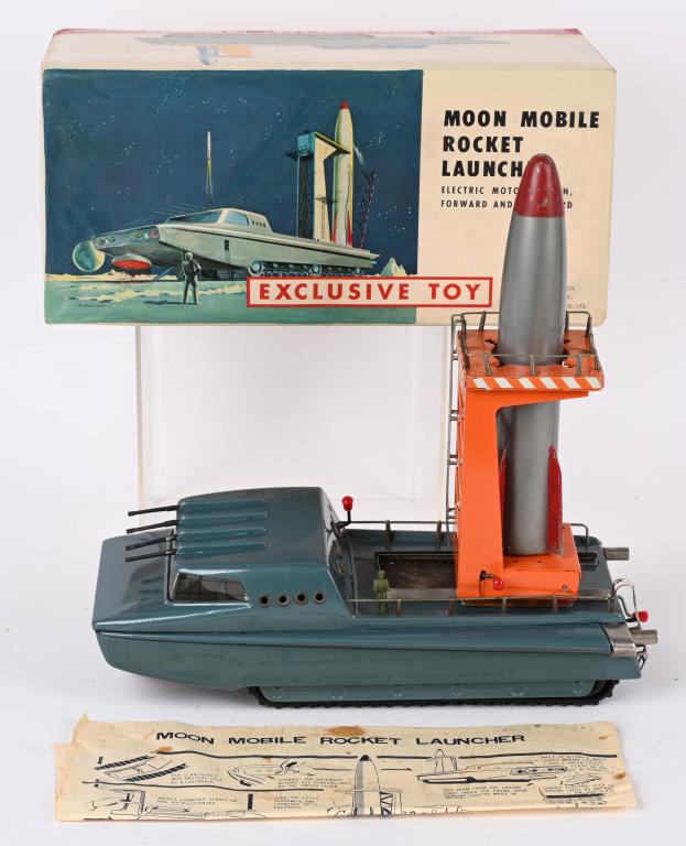 BANDAI MOON MOBILE ROCKET LAUNCHER w/ BOX: Sears Exclusive battery operated Moon Mobile Rocket Launcher. All original and complete. Looks never played with condition. Worked when tested. Boxed with Inserts. 13" Excellent Provenance: Paul Lips 