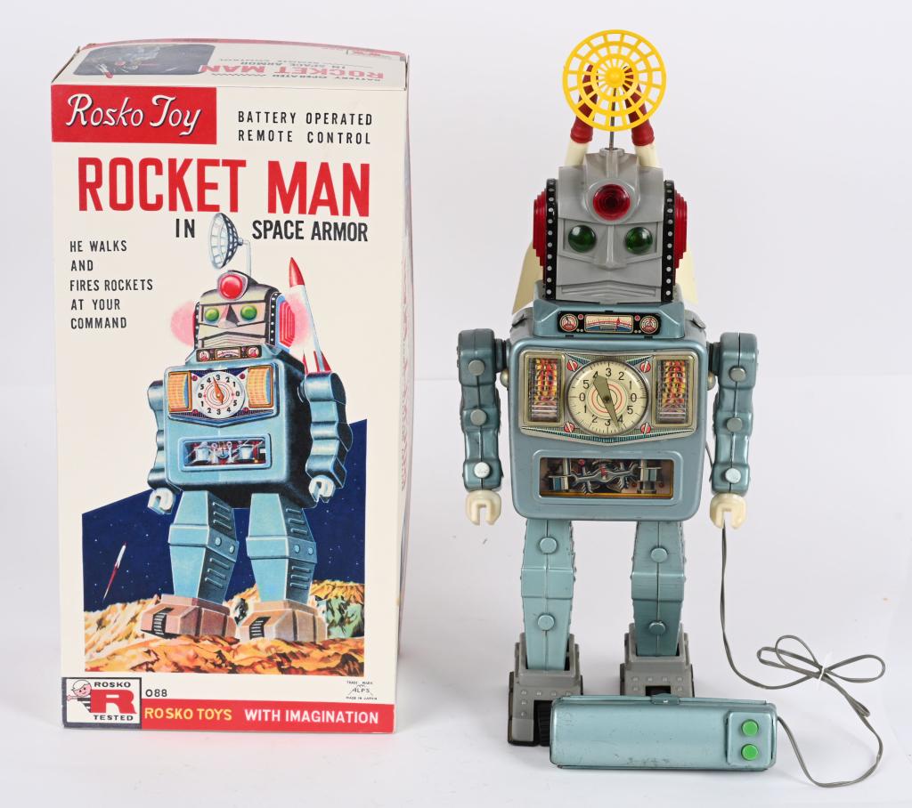 ALPS BATTERY OP ROCKET MAN: Japan battery operated Rocket Man in Space Armor. All original and complete with Rockets and Antenna. Toy has nice colors. Has original Remote Control Battery Box. A very clean example. Worked when te
