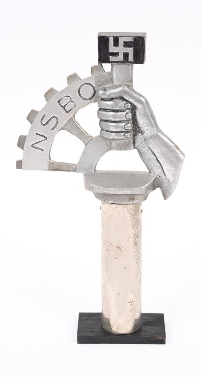 WWII NAZI GERMAN NSBO POLE TOP FINIAL WW2: Very attractive, cast aluminum and nickel/silver plated alloy pole top. Takes the form of the NSBO emblem of a hand holding a hammer with a static swastika to its head, with a partial cogged wheel wit