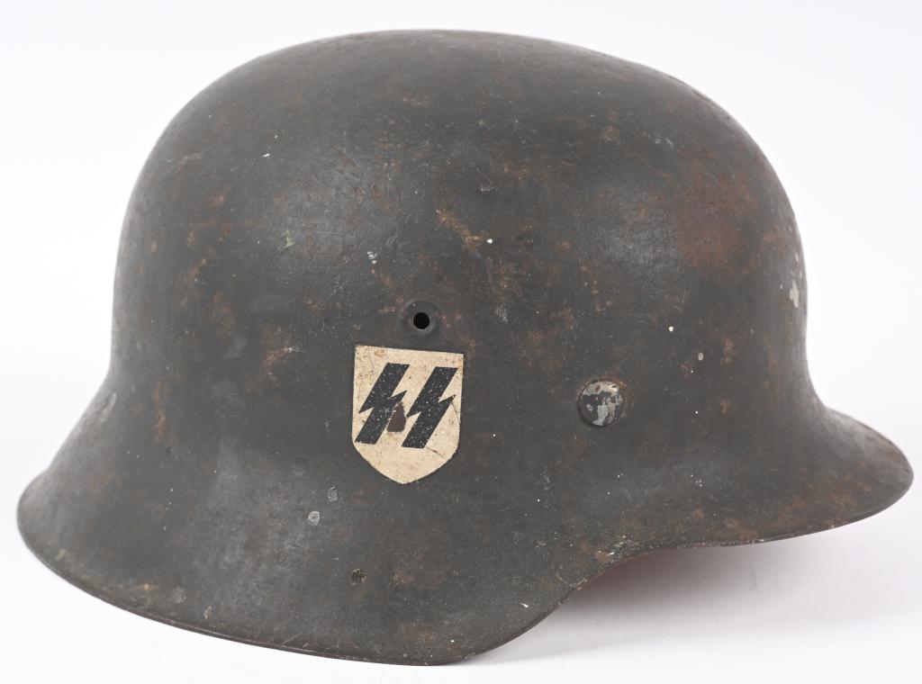 WWII NAZI GERMAN M42 SS SINGLE DECAL HELMET EF64: This stamped sheet steel construction helmet retains about 85% of its original field-gray paint. The right side of the helmet has a first pattern, "SS" runic decal with black runes on a silver shield 