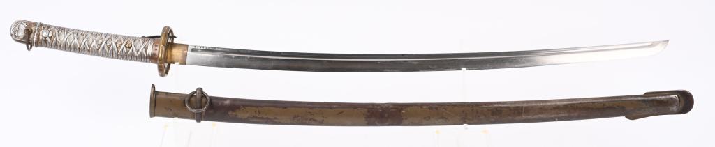JAPANESE WWII TYPE 95 NCO SHIN GUNTO KATANA WW2: 27 1/2" cutting edge on bright blade has Has fuller on each side and is serial numbered 148935. The blade has a visible light hamon. The metal saya retains about half of the original OD green pa