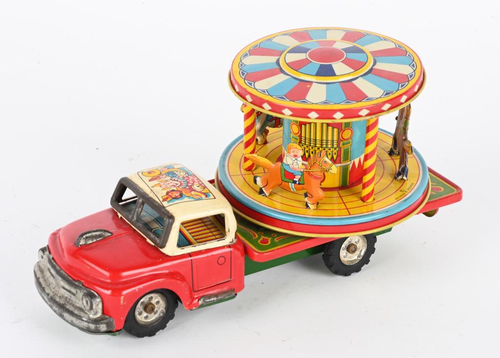 JAPAN TIN FRICTION MERRY GO ROUND TRUCK (1 of 3)