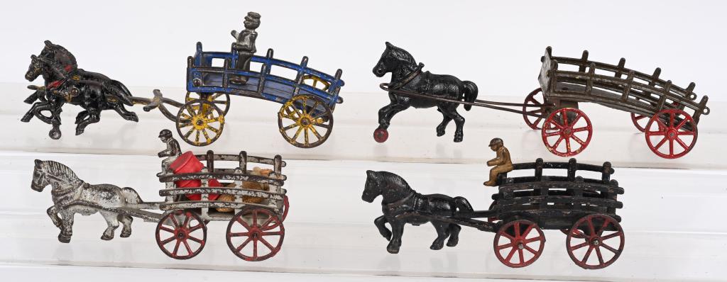 4- CAST IRON HORSE DRAWN STAKE WAGONS (1 of 3)