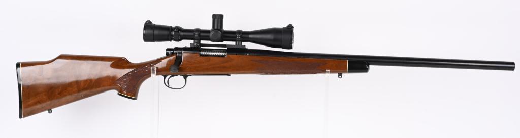 REMINGTON MODEL 700 BDL HEAVY BARREL VARMINT: SERIAL NUMBER: C6633240. BARREL: 24". CALIBER: .308 WIN. MANUFACTURED: 1991. Heavy weight barrel with standard markings. Original blued finish and lacquered wood stock, with cross cut checkering on th