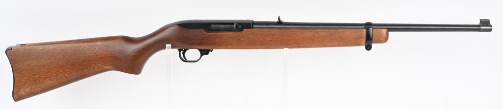 RUGER MODEL 10/22 WITH WOOD STOCK: SERIAL NUMBER 128-05952 BARREL 18 1/2" CALIBER 22 LONG RIFLE MANUFACTURED 1987. Blue finished steel barrel with anodized alloy frame. 10 shot detachable magazine (not included) . Varnish hardwood stoc