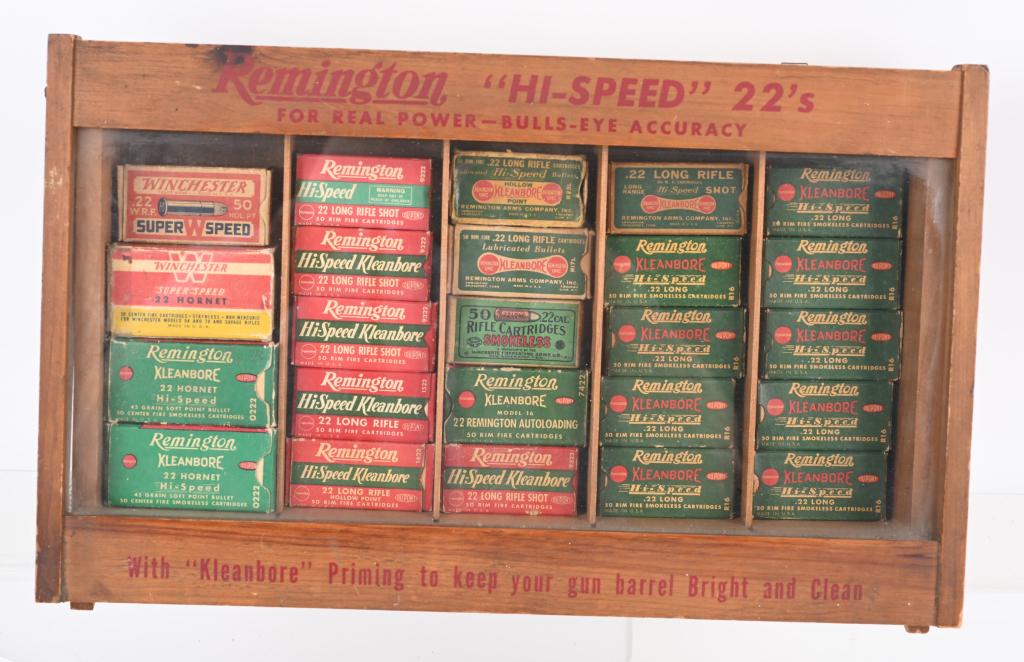 PRE WAR REMINGTON .22 DISPENSER WOOD CASE: 24 Boxes of ammo. (3) boxes of 22 hornet (on partial), one 2-pc sealed box Winchester 22, one box Rem. 22 autoloading , balance .22 long & long rifle ammo. Most appear full. Great old store display.