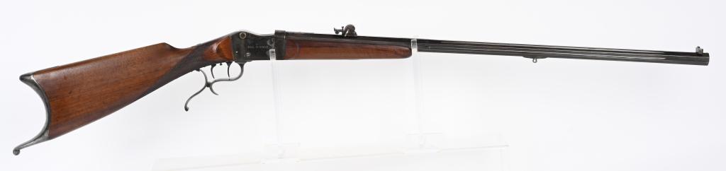 ANTIQUE ROB WIDMER 22 LR SCHUETZEN RIFLE: SERIAL NUMBER N/A BARREL 29 /4" CALIBER 22 LONG RIFLE MANUFACTURE CIRCA 1880. Fluted octagon barrel with target blade front sight and slide adjustable and fully adjustable rear sight. 2 piece walnut t