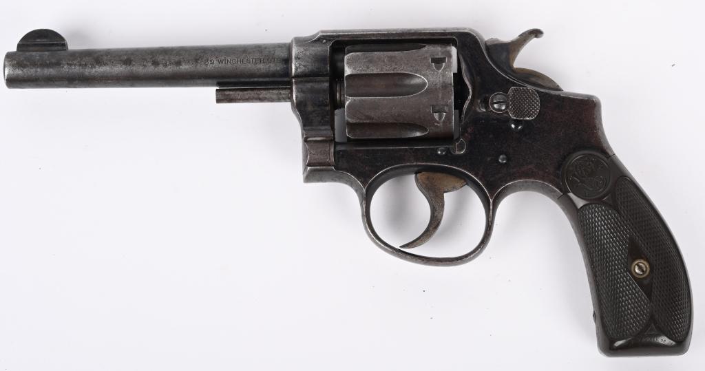 SMITH & WESSON 1ST ISSUE 32-20 H.E.: SERIAL 3120. BARREL 5". CALIBER .32-20. MADE 1899-1902. Built on round butt, K-frame, 4-screw, gutta percha grips, blue finish, case color hammer & trigger. Missing ejector rod head. Condition. Retain