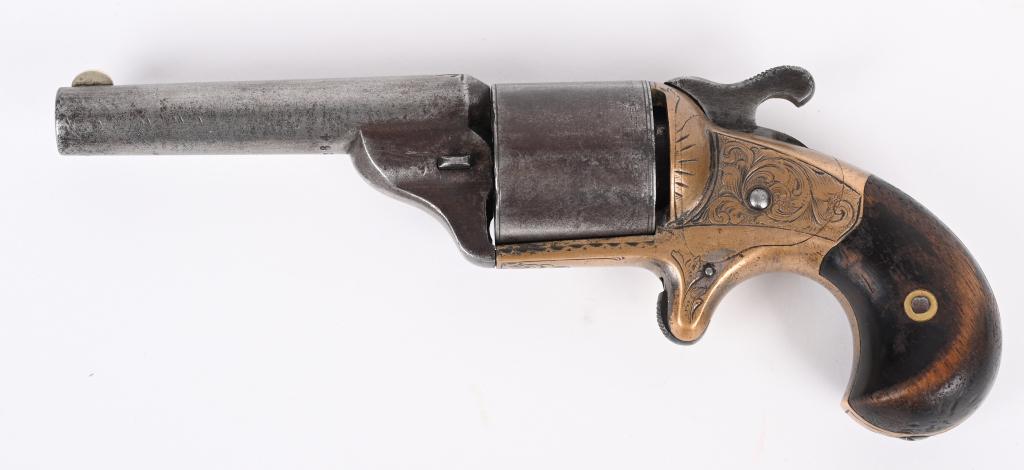 MOORES PAT. FIREARMS CO FRONT LOADING REVOLVER: SERIAL 12284. BARREL 3". CALIBER 32 TEAT-FIRE. MADE 1864-1870. Single action, spur trigger, engraved brass frame, bird head grips. Condition. Metal is soft patina. Sharp engraving. most finish is worn