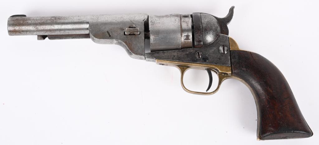 COLT RD. BBL POCKET NAVY W / EJECTOR: SERIAL 13134. BARREL 4.5". CALIBER 38 RF. MADE 1873-75. Conversion with mixed numbers. Features one piece varnished walnut grips. Brass straps have matching number 83153. Barrel, frame & cylinder have