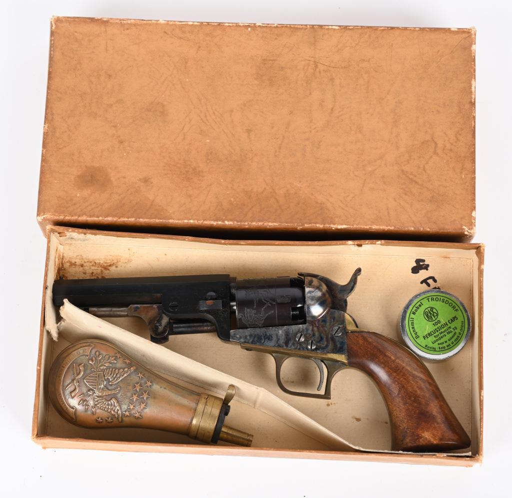BOXED EARLY EIG IMPORTED COLT 1849 POCKET REVOLVER: SERIAL 1198. BARREL 4". CALIBER 31. San Marco made the gun for Eig. (marked under barrel.)The box has dated Feb 4, 68 written inside. Box has no label but has divider for powder flask (included) These