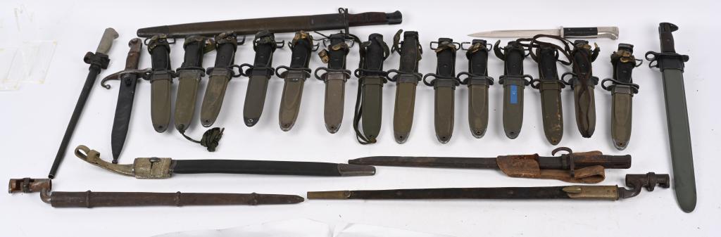 LOT OF MOSTLY U.S. MILITARY BAYONETS: Lot contains: 9 various M7 Bayonets, all with M8A1 scabbards. M5A1 scabbard with M8A1 scabbard. 4 M4 bayonets. Three have M8A1 scabbards. One has an M8 scabbard. Reproduction M1905 U.S. Springfield ba