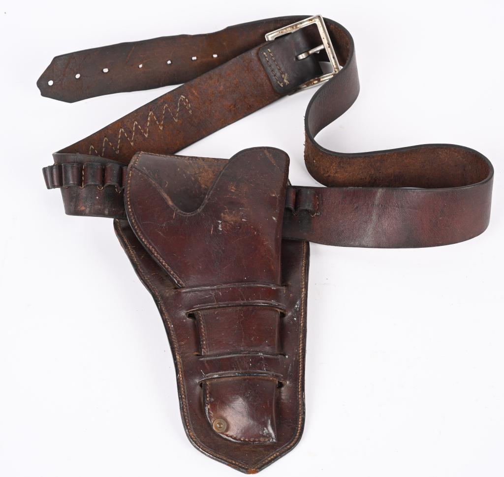 BEST QUALITY DOUBLE LOOP HOLSTER & CARTRIDGE BELT: Made for the large big bore Smith & Wesson double action Frontier top break 44. The leather is 1/4" thick and the inside is also lined in leather. Will take a Smith with 4-5" barrel. You could not fin