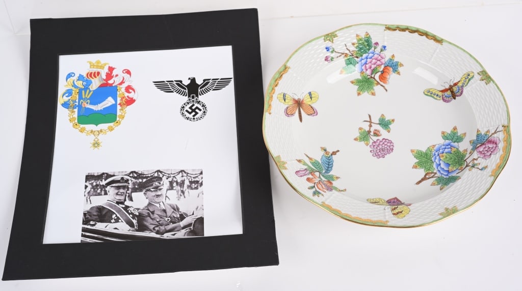 WWII NAZI ADOLF HITLER SOUP BOWL BY MIKLOS HORTHY: A hand painted white porcelain soup bowl presented to Adolf Hilter. The base bears the mark of Hungarian porcelain manufacturer Herend, along with a German national eagle and a coat of arms depicting 