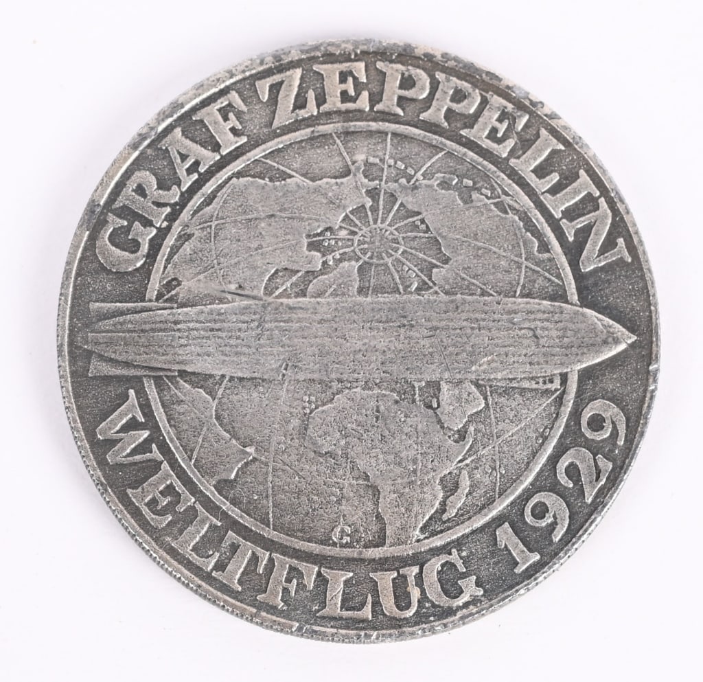 WWII GRAF ZEPPELIN FLIGHT SILVER 5 MARK COIN 1930: This is the famous Graf Zeppelin Silver 5 Mark Coin of the Weimar Republic. It was issued in 1930 to commemorate the Zeppelin's circumnavigation of the globe in 1929! A truly beautiful historic coin w