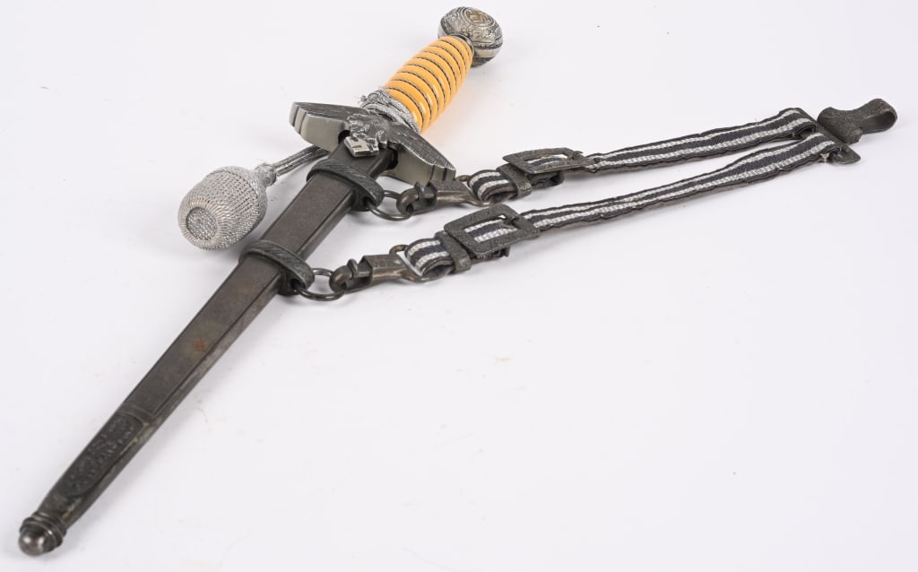 WWII NAZI GERMAN LUFTWAFFE OFFICERS DAGGER WW2: Roughly 29cm long, bright, nickel/silver plated, double edged, drop forged steel, stiletto style blade with a flat central plane. Maker marked to Carl Eickhorn. The leather washer is still intact. The