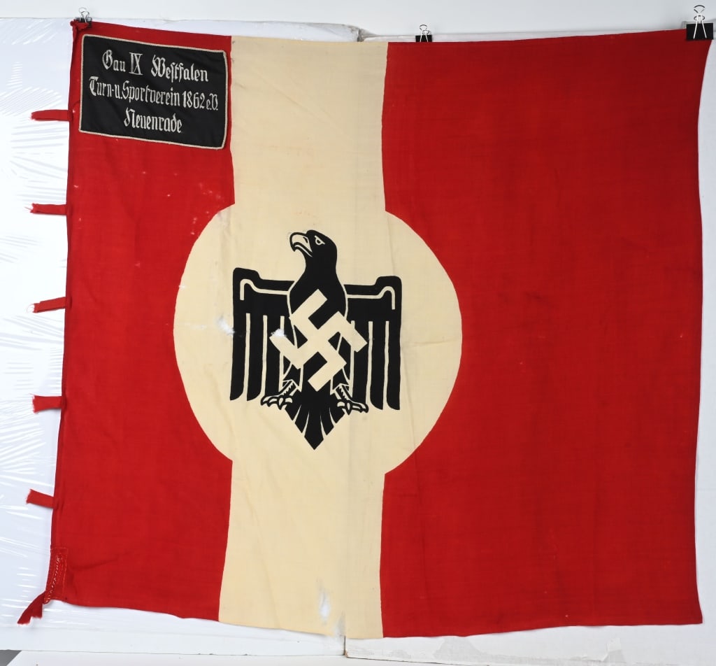 WWII NAZI GERMAN DRL SPORTS FLAG GAU WESTFALEN: WWII Nazi German DRL Standard for the Gau IX of Westfalen for a sporting events. The flag having scattered moth holes and tears. Flag measures 46 X 53 and is double sided with a single panel to one si