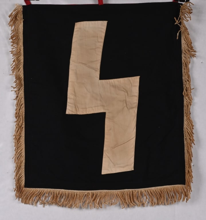 WWII NAZI GERMAN DJ FANFARE TRUMPET BANNER WW2: An approximately 14 1/2" x 16 1/2" double sided, multi-piece linen construction banner. The reverse side has a large, white Sig-rune stitched to its black background field. The obverse has a black mob