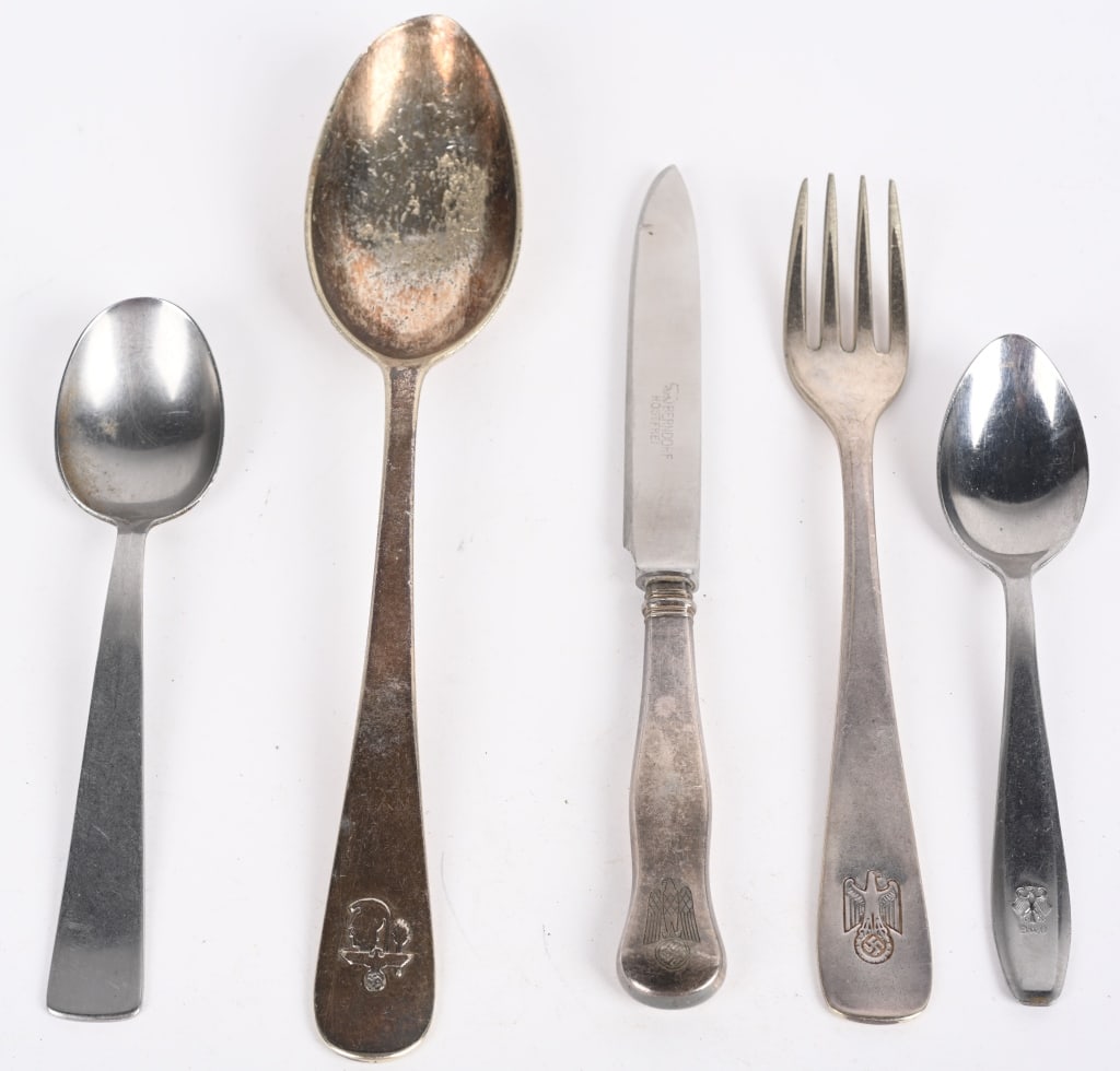 WWII NAZI GERMAN UTENSILS LOT NSDAP ART MINISTRY: WWII Nazi German utensils lot to include 1) Large Art Ministry Spoon measuring 8 3/8 inches marked Bruckmann 90 to the reverse 2) DAF School marked Dessert Spoon.. 3) Weimar Period Dessert Spoon marke