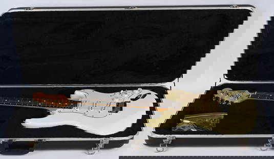 1989 FENDER STRATOCASTER ELECTRIC GUITAR: 1989 Fender Stratocaster Electric Guitar. Scarce Olympic White in colors. Great looking original condition. Serial #E9112135. Comes with hard case.