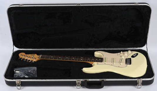 1989 FENDER STRATOCASTER ELECTRIC GUITAR: 1989 Fender Stratocaster Electric Guitar. Scarce Olympic White in colors. Great looking original condition. Serial #E9112135. Comes with hard case.