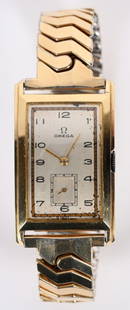 1939 OMEGA RECTANGULAR 14K GOLD WATCH: Beautiful 1939 Omega Rectangular 14k Yellow Gold Watch. Wonderful condition with a very clean face. The case is solid 14k Gold with stretch style band. This watch was just professionally serviced and