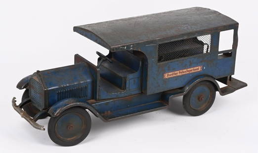 STURDITOY PRESSED STEEL POLICE PATROL: Original Sturditoy Police Patrol. Original paint and bumper. Decals are correct replacements. Missing headlights and damage to screen on one side. A very rare and desirable truck. Should clean to a hi