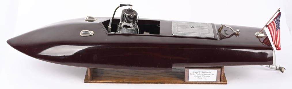 REUHL GAS POWERED SPEED BOAT: Reuhl Gas Powered Speed Boat. Early version with bakelite body with wood bottom. All original and complete with Motor and Drive System. Has a tight crack in body. Nice looking Gas Powered Boat. 24" Ve