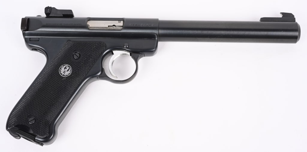 RUGER MARK II BULL BARREL TARGET PISTOL: SERIAL 210-34712. BARREL 6 3/4". CALIBER 22LR. MAGAZINE 10-RDS. Blue finish, target sights, black eagle plastic grips. Condition. Near new with light handling. MODERN DB