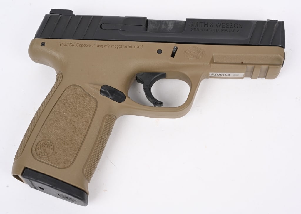 SMITH & WESSON MODEL SD9 SEMI AUTO PISTOL IN 9MM: SERIAL NUMBER: FZU0148. BARREL: 4". CALIBER: 9MM LUGER. MANUFACTURED: 2010S. Standard markings and features. 3-dot sights. Blued steel slide and flat dark earth colored polymer frame. Includes factory