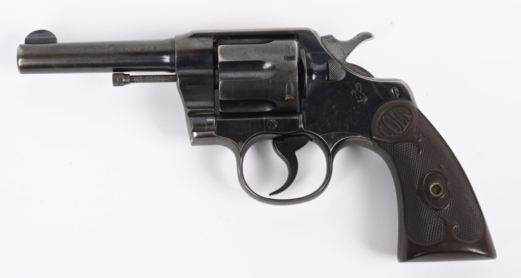 COLT MODEL ARMY SPECIAL DOUBLE ACTION REVOLVER: SERIAL NUMBER: 469596. BARREL: 4". CALIBER: .32-20. MANUFACTURED: 1922. Standard marking and features. Colt pony on the left side plate. "VP" proof on the top of the trigger guard. Bore is Factory sig