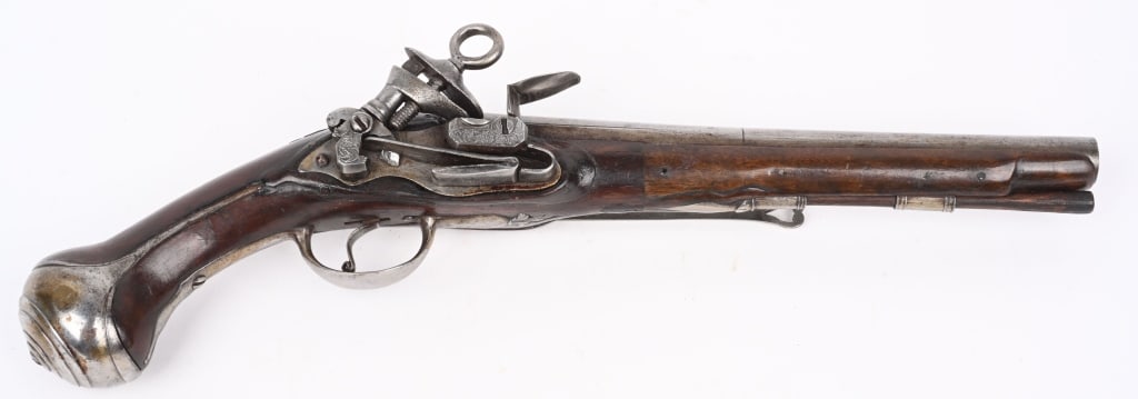 EARLY SPANISH MICOLET FLINTLOCK PISTOL: Light engraving on the Miquelet lock, walnut stock, four gold touch marks on breech, sash hook, solid rib, period ramrod. Stock and barrel have been repaired with splice. Very good with great early lo